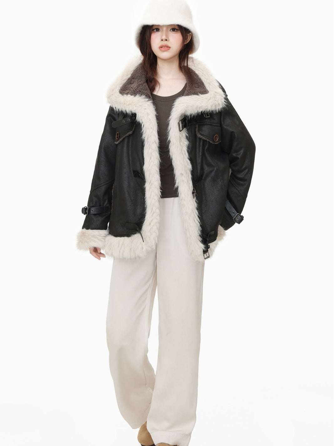 Model wearing black wool cotton blend Leather Coat with faux fur lining and oversized fit, styled for winter fashion.