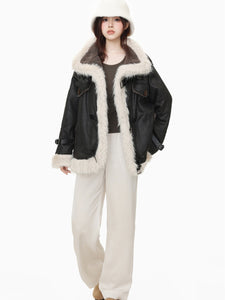Model wearing black wool cotton blend Leather Coat with faux fur lining and oversized fit, styled for winter fashion.
