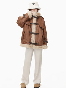 Brown wool cotton blend Leather Coat modeled with toggle closures and faux fur trim, ideal for cold weather style.
