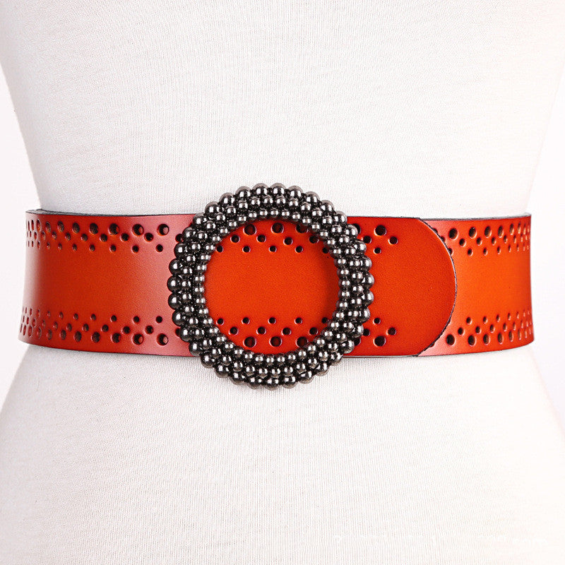 Orange genuine leather women's belt no hole with detailed perforations and round beaded buckle, designed for dress fashion.